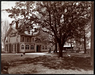 View through the trees of the Woodmansten Inn, Westchester, New York, 1901